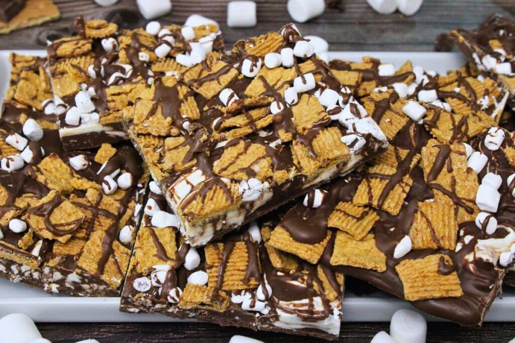 platter of smores bark stacked on top of each other with golden grahams