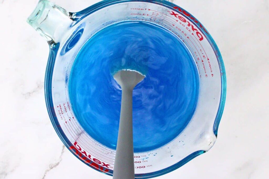 add blue jello and whisk until fully dissolved then add vodka