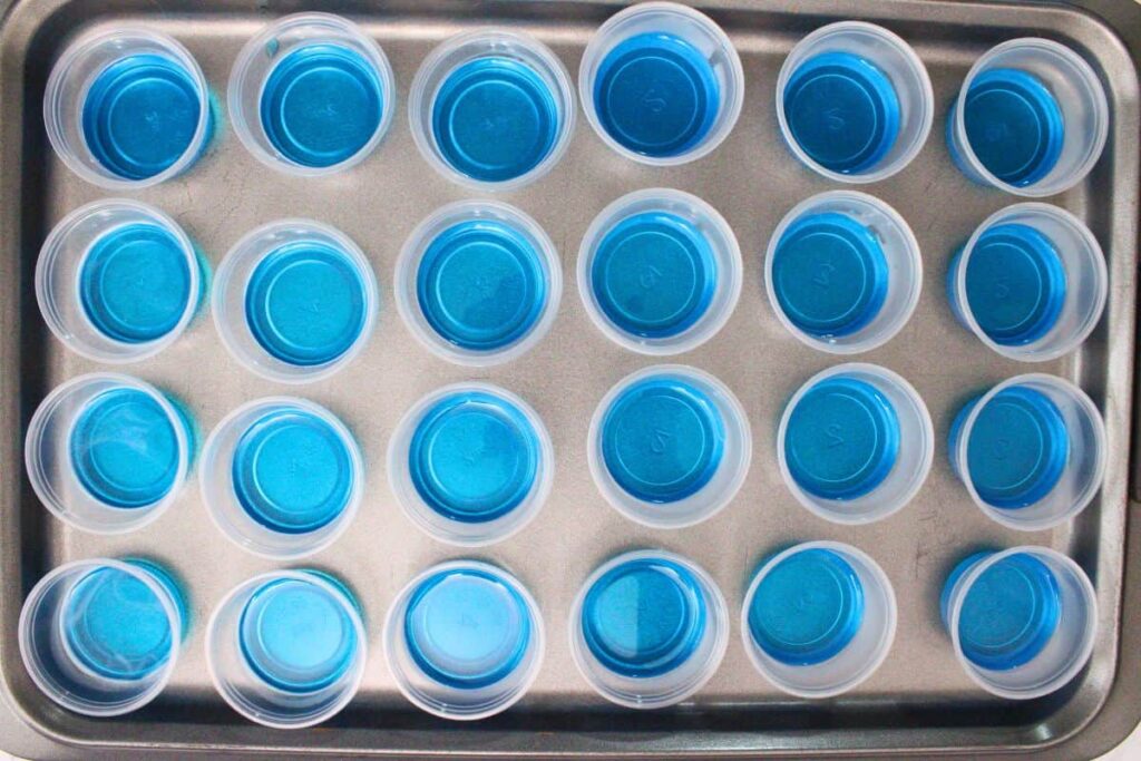 pour blue jello mixture into the base of jello cups