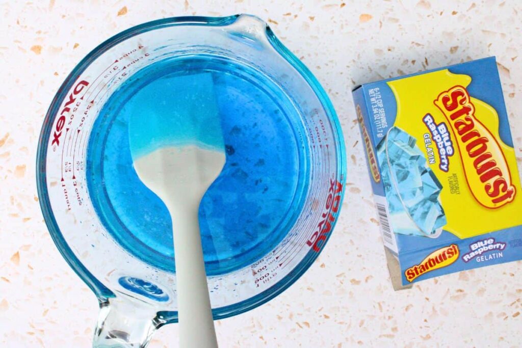 add blue gelatin mix to boiling water and whisk