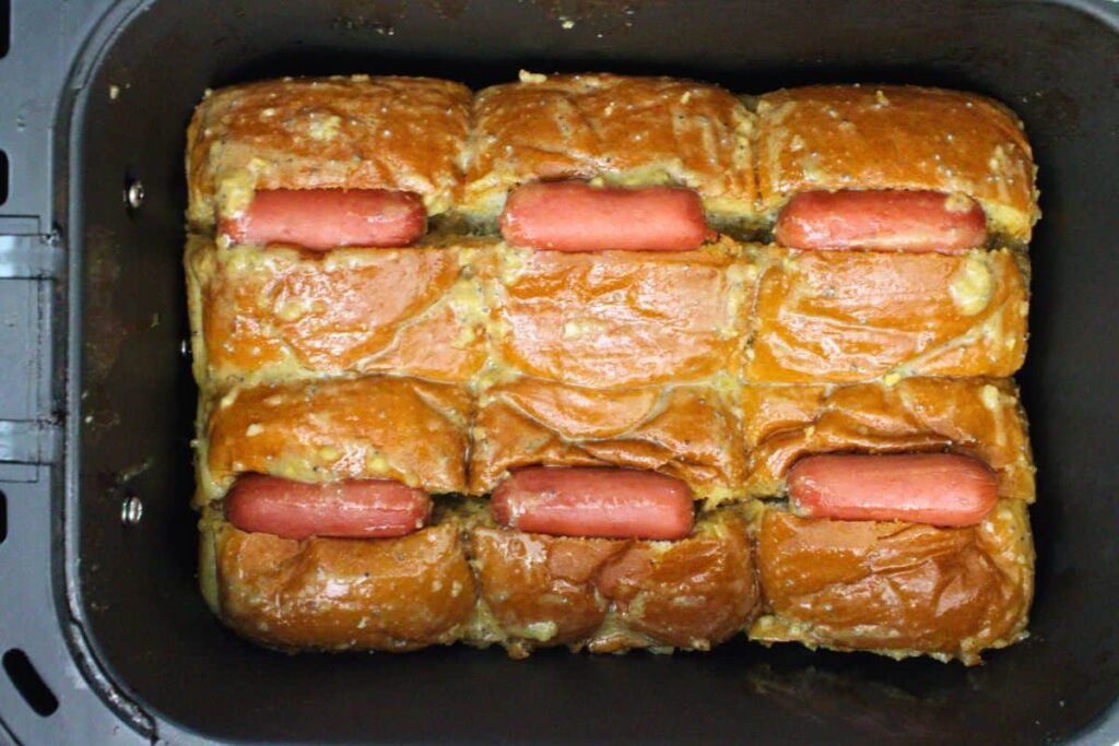 place coated hot dog sliders in air fryer basket
