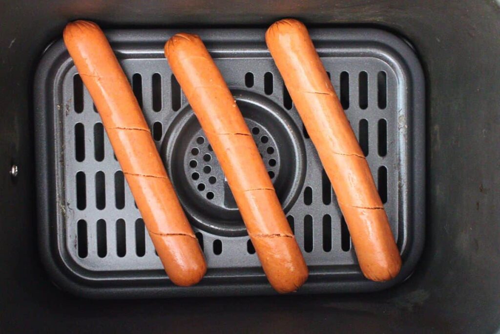 place spiral hot dogs in air fryer basket