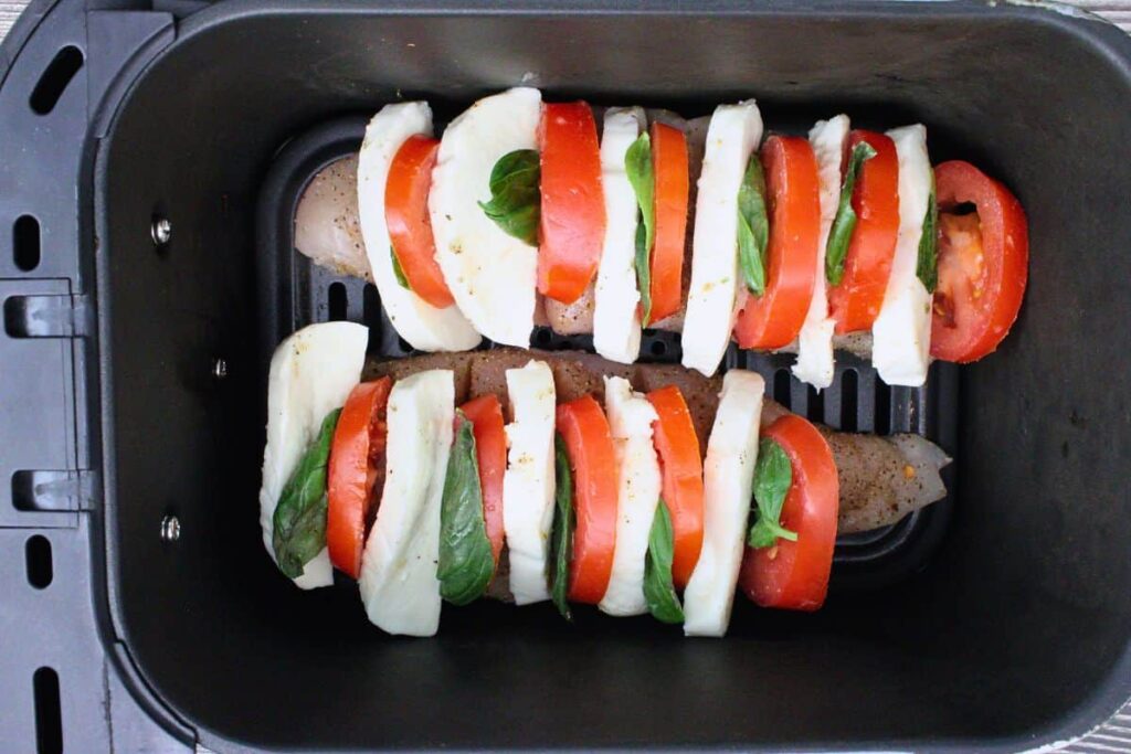 place filled hasselback chicken in air fryer basket