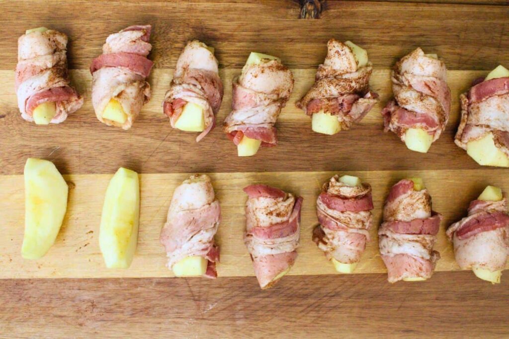 wrap half a strip of bacon around each apple slice