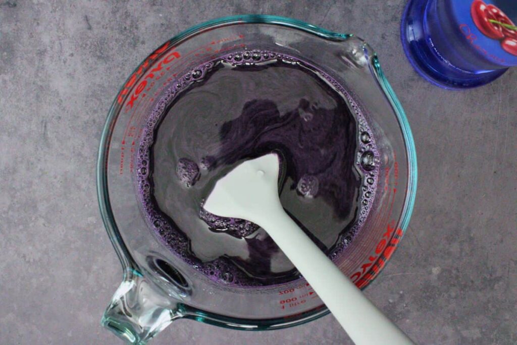 mix vodka and cold water into the black jello mixture