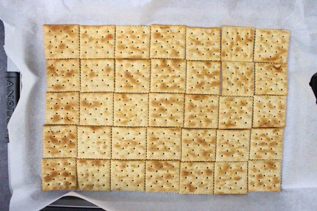 arrange crackers as a base on baking sheet