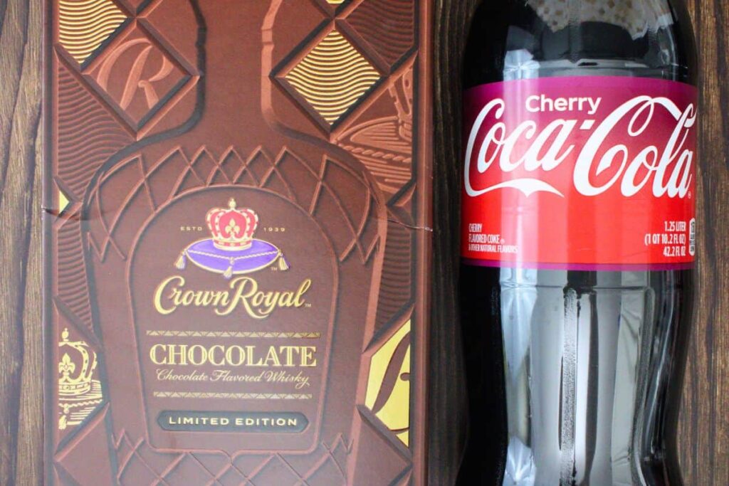 chocolate crown royal in box next to cherry coke bottle