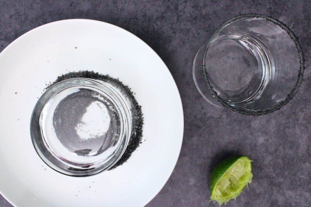 rim black magic margarita glass with lime and black salt