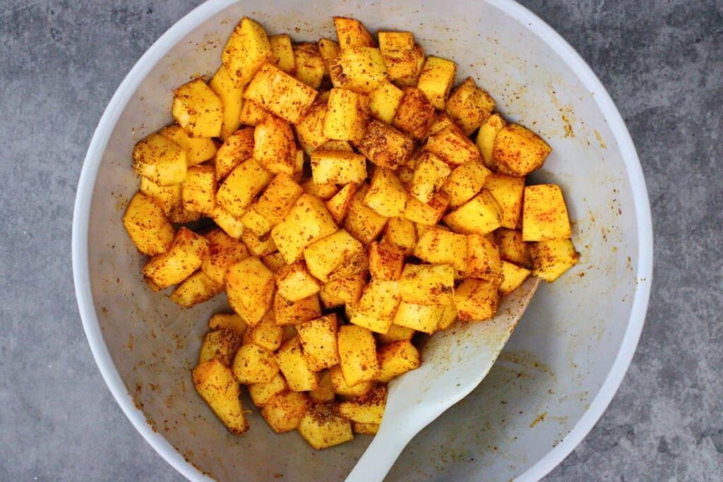toss cubes pumpkin in seasonings