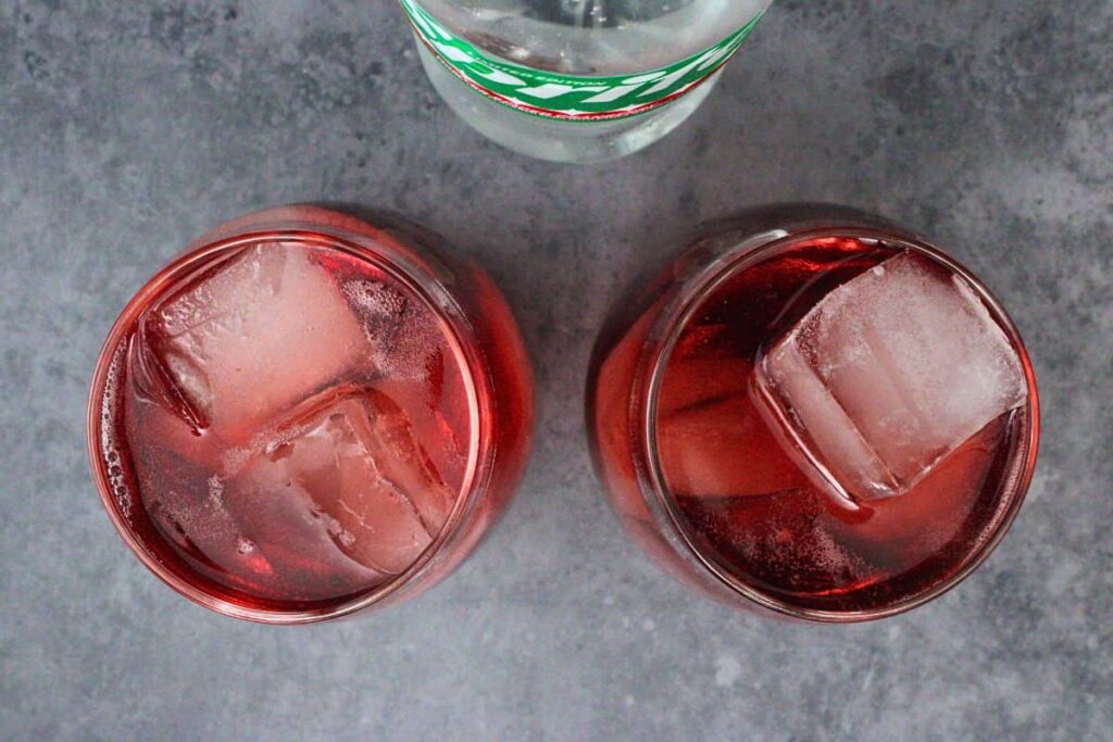 add ice to cranberry and vodka then top with sprite