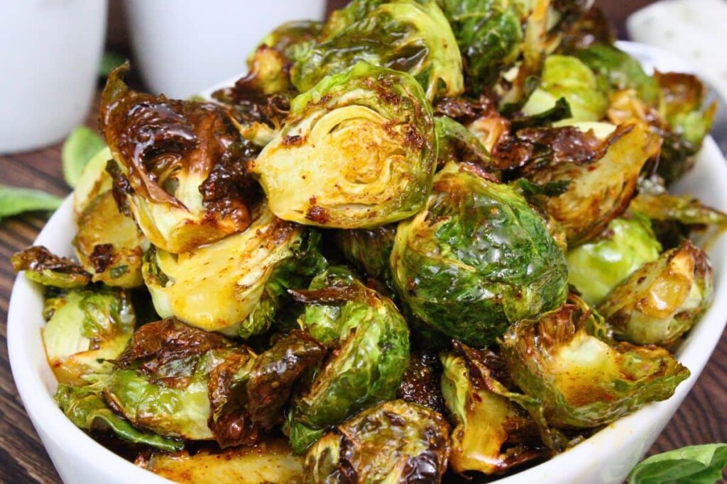 closeup view of copycat longhorn brussel sprouts stacked in a serving bowl