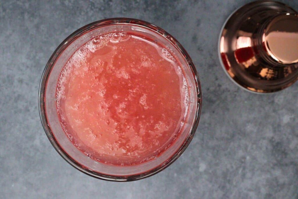 combine vodka, cranberry juice, lemon juice, simple syrup, and egg white in cocktail shaker