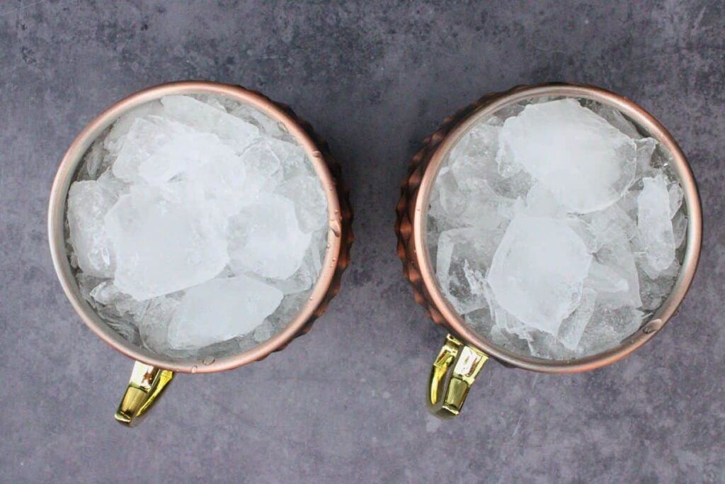 fill cranberry moscow mule mug with crushed ice