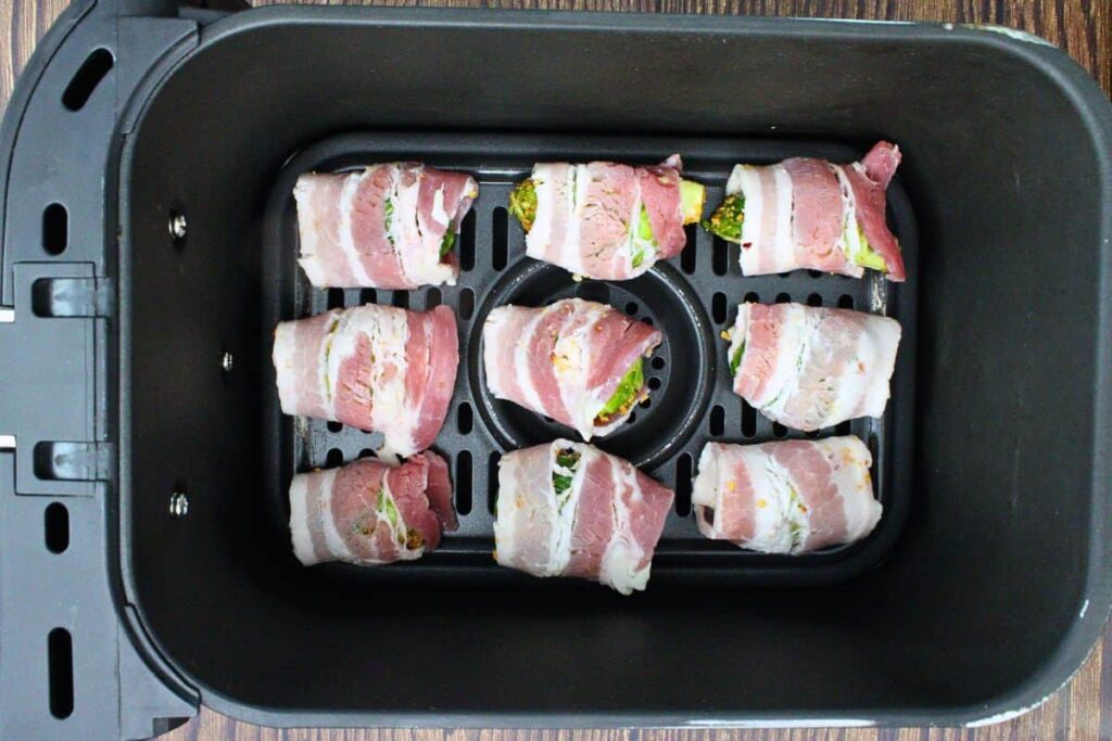 place bacon wrapped sprouts in air fryer basket
