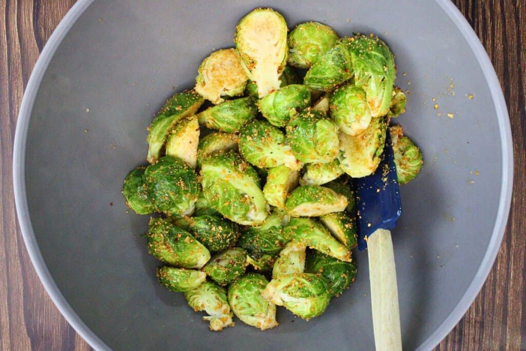 toss halved brussel sprouts with olive oil and maple seasoning