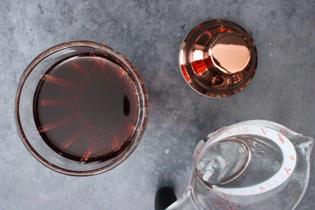 add vodka, triple sec, vermouth, and cranberry juice to cocktail shaker