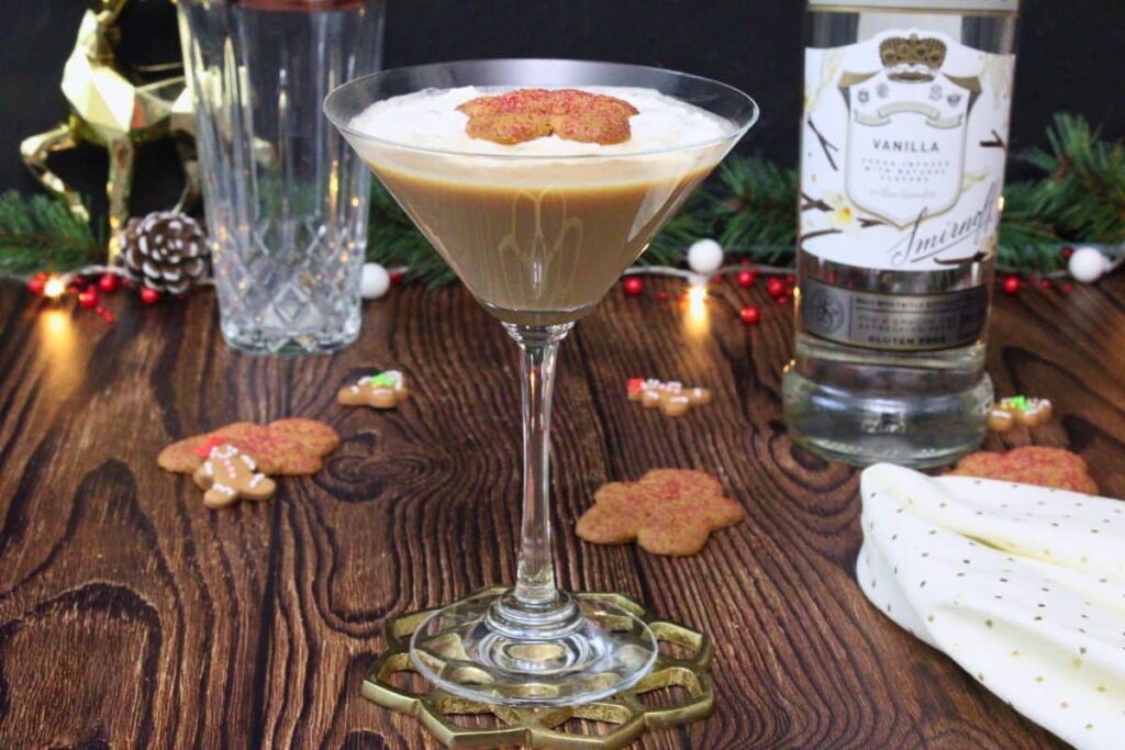 gingerbread martini outback steakhouse copycat drink with whipped cream and cookie in front of vodka bottle