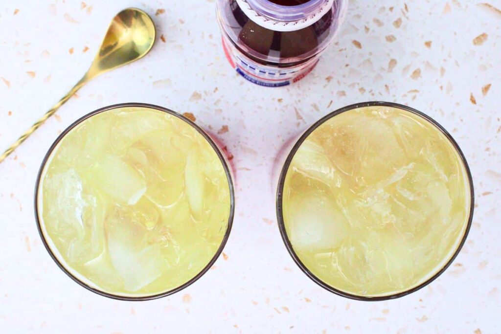 slowly layer cranberry juice with pineapple vodka mix