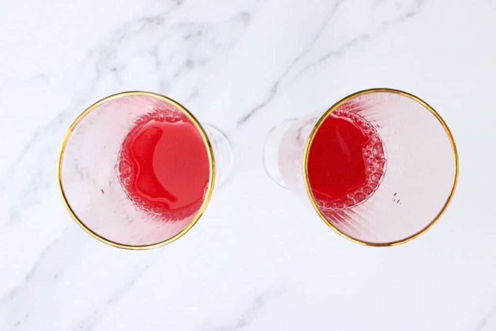 add blood orange juice and triple sec to champagne flutes