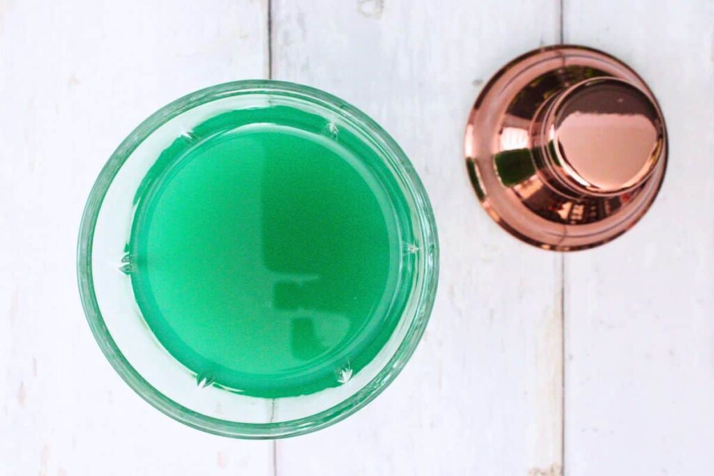 add whiskey, pineapple juice, blue curacao, and schnapps to shaker