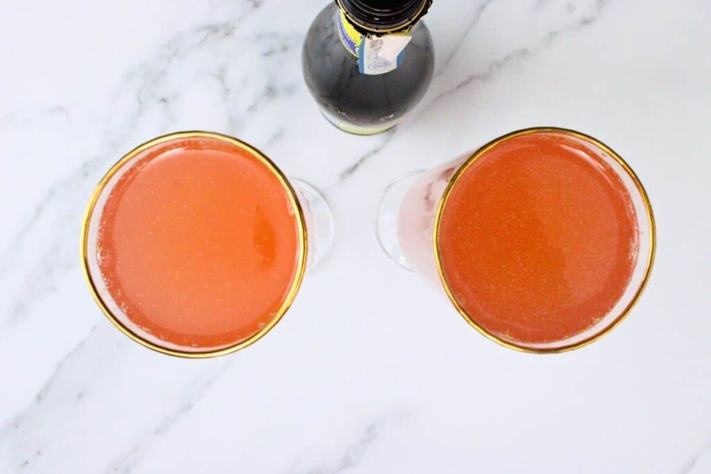 pour champagne over blood orange juice
