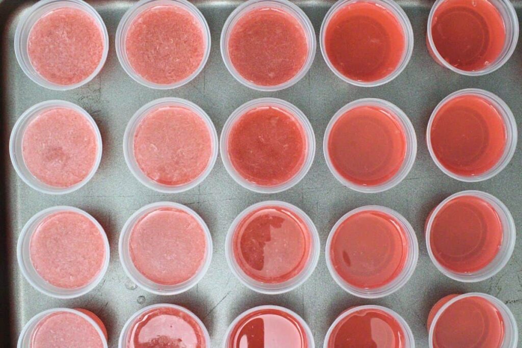 pour pink jello mixture into individual cups