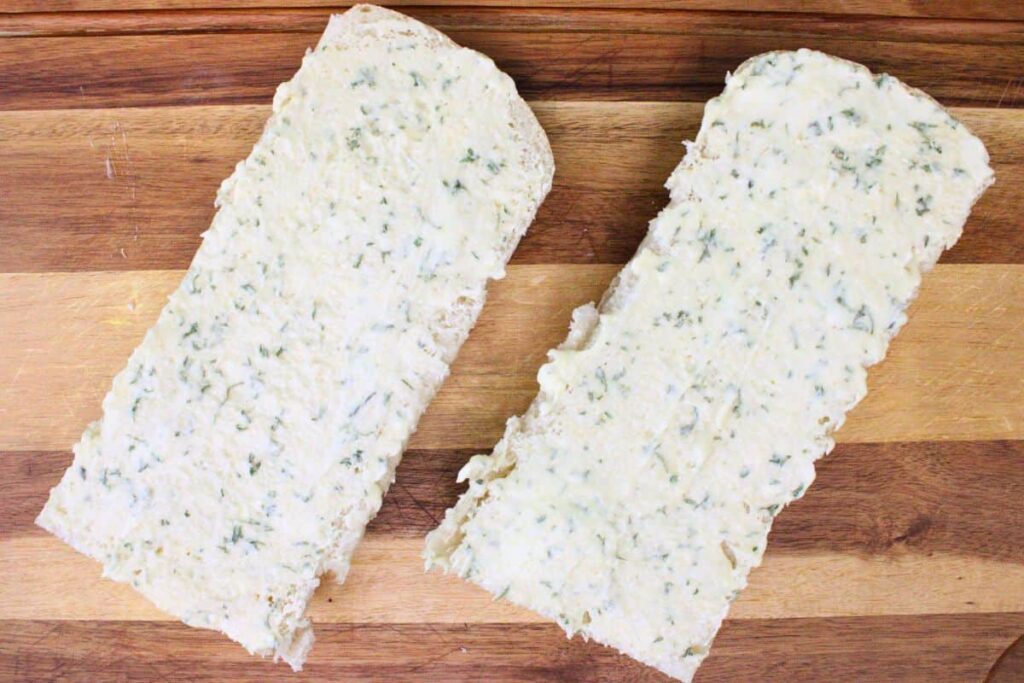 spread garlic butter mixture over french bread