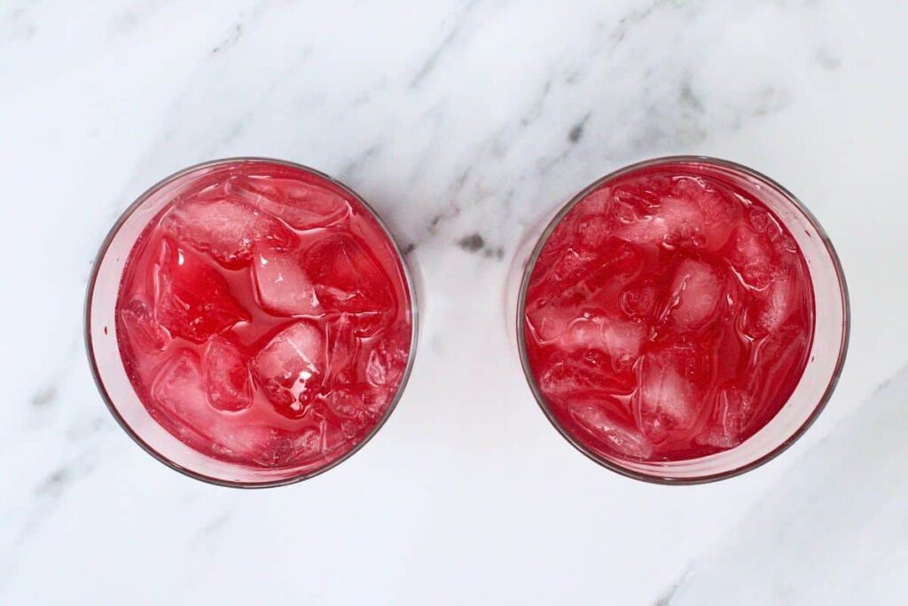add tequila, blood orange juice, and lime juice over crushed ice