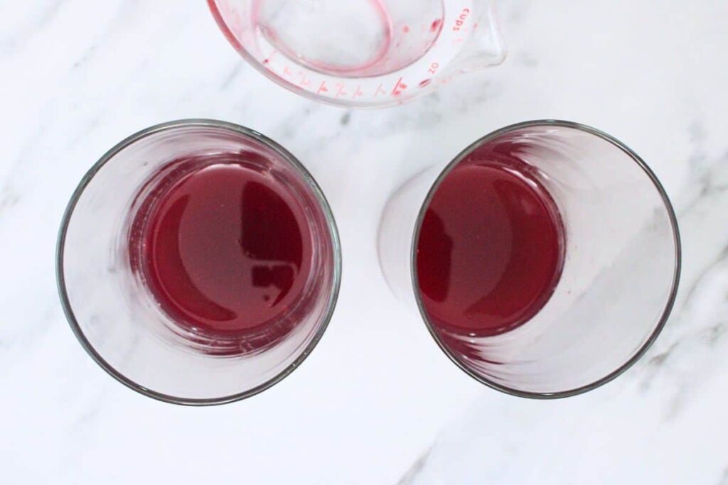 add vodka and blood orange juice to highball glass