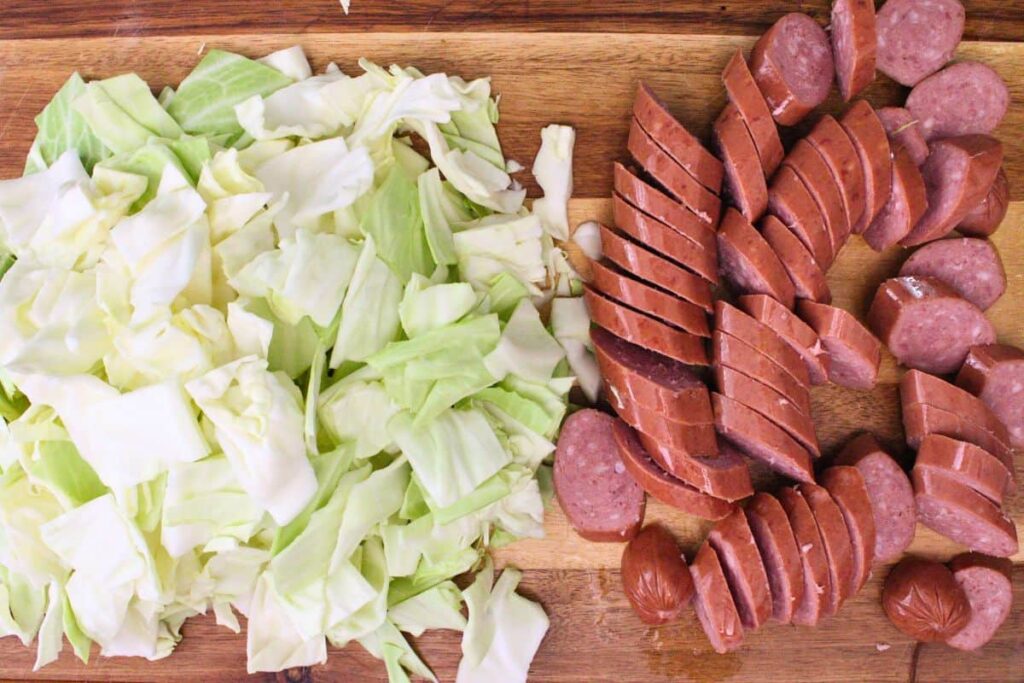 chop cabbage and cut sausage into medallions