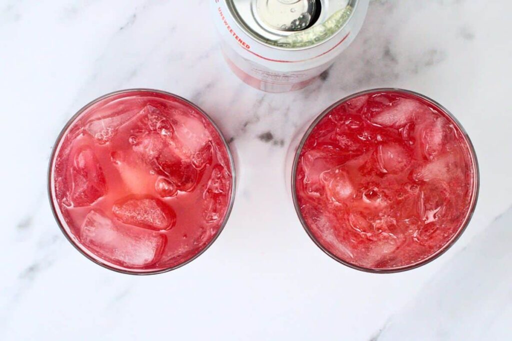 pour blood orange sparkling water over tequila mix