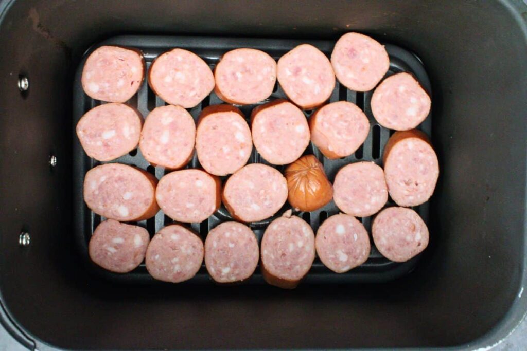 add sliced kielbasa to air fryer basket