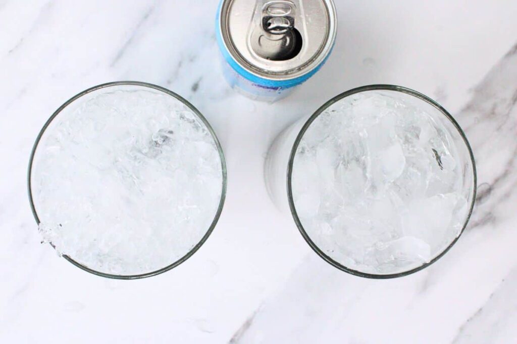 fill lavender mojito glass with crushed ice and club soda