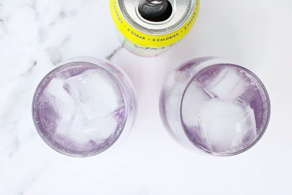 add ice and sparkling water to finish lavender spritz