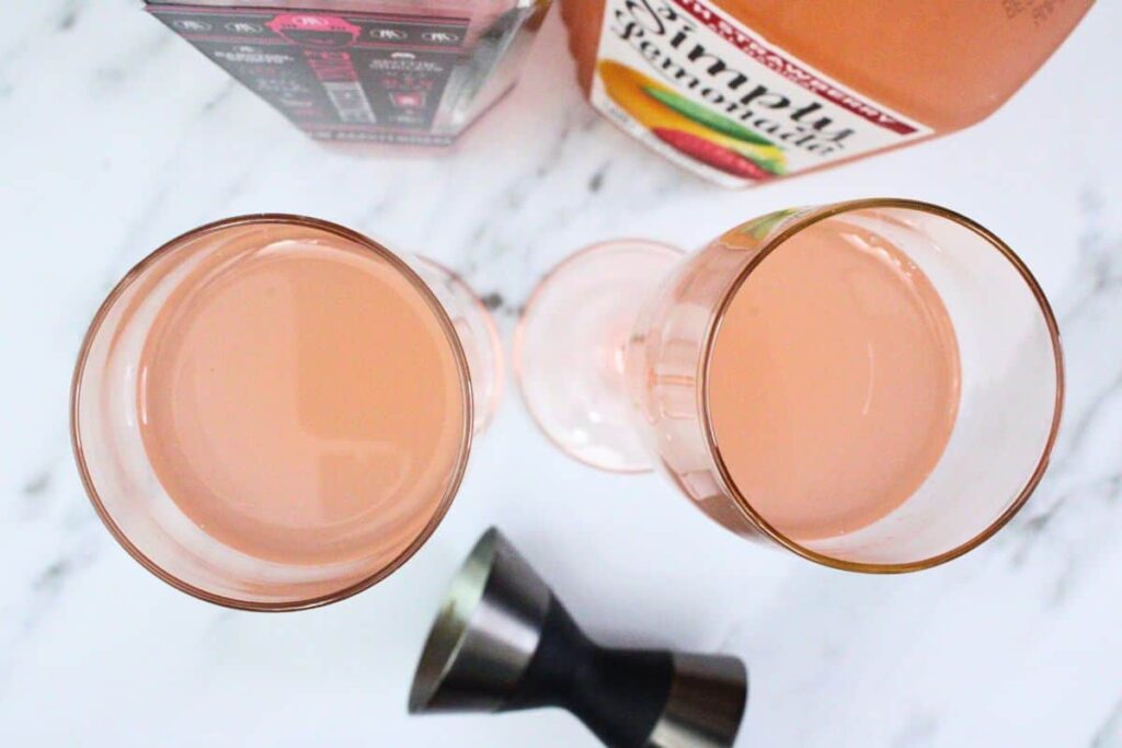 add pink whitney vodka and pink lemonade to champagne flute