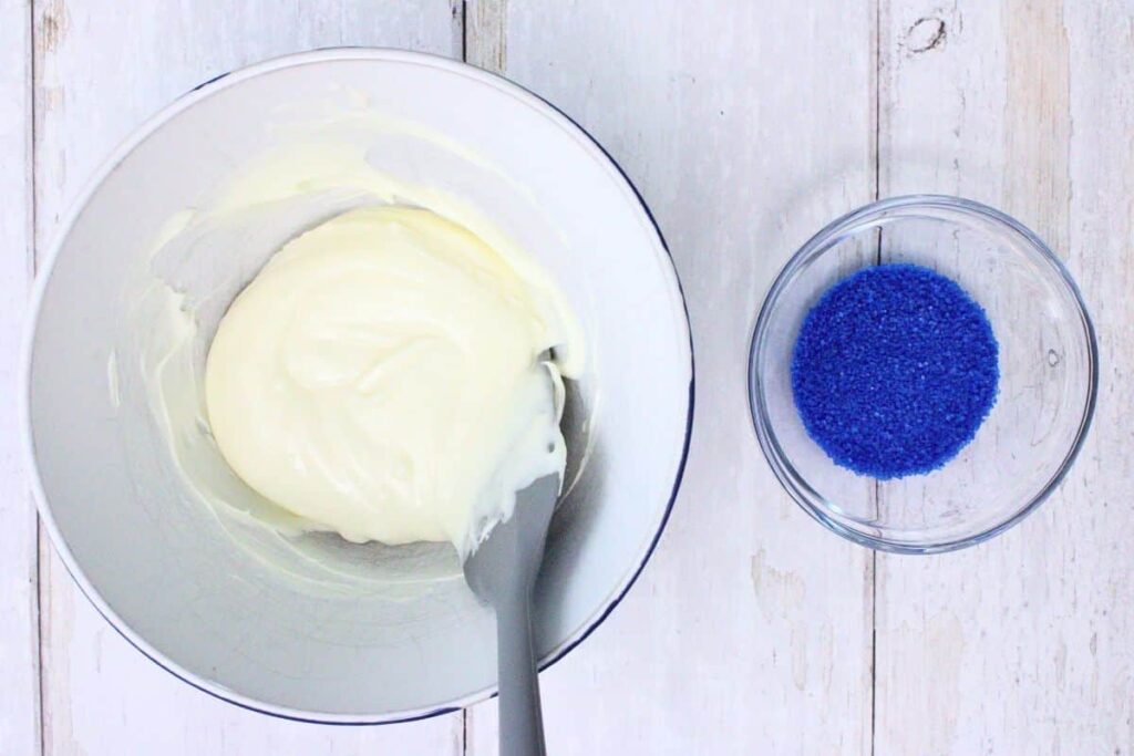 melt the white chocolate chips in a bowl and add sanding sugar in a separate small bowl