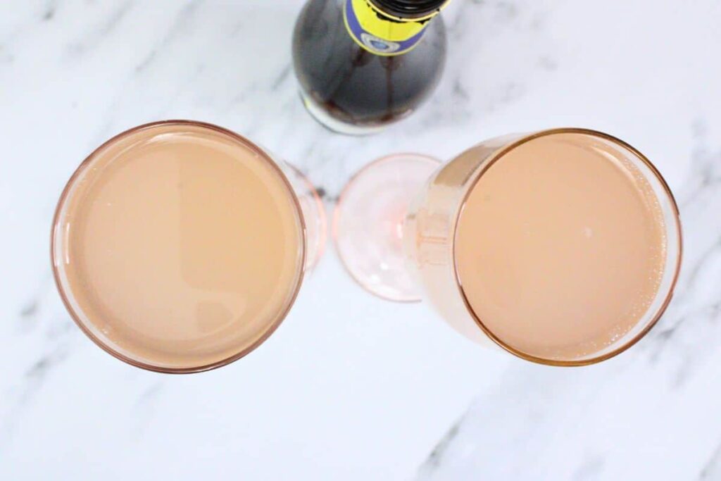 top pink lemonade mimosa with chilled champagne