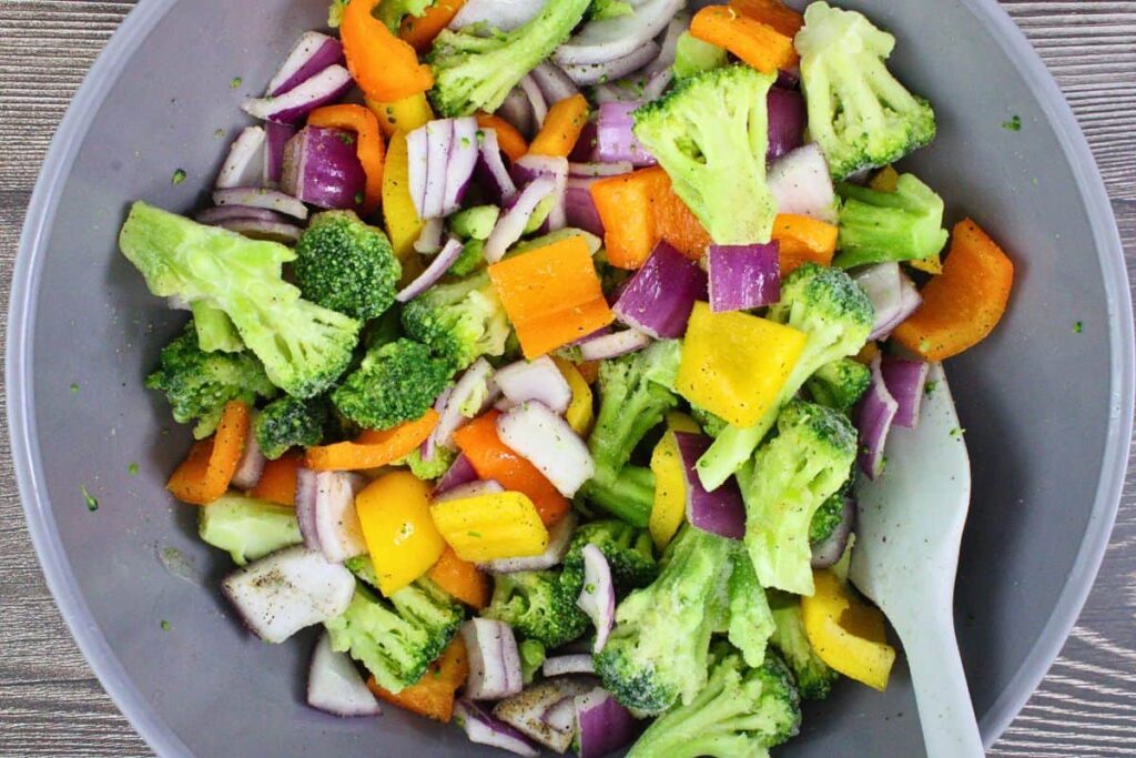 toss the stir fry vegetables with olive oil and seasonings
