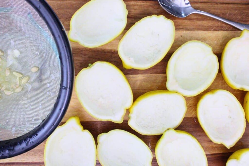 cut lemons in half and remove fruit from the rinds and strain for juice
