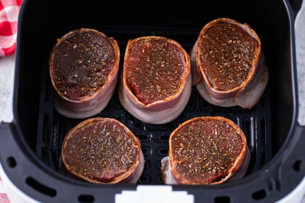 place bacon wrapped filet in the air fryer basket