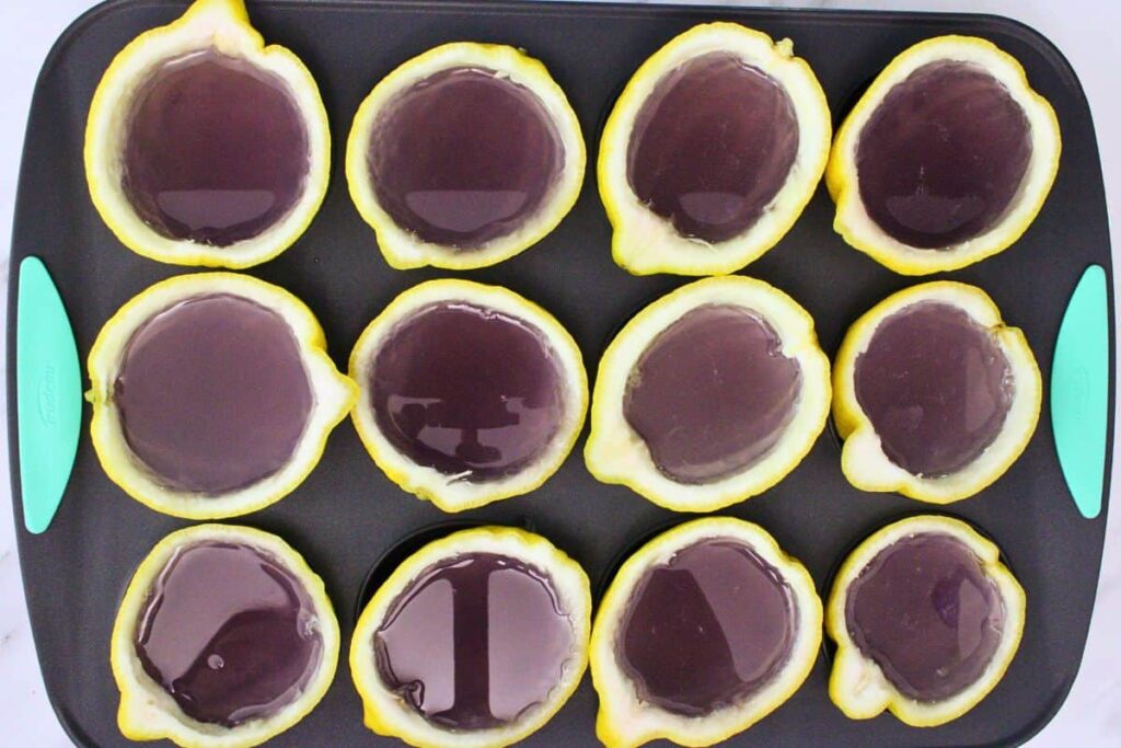 pour lavender gelatin mixture into lemon rinds