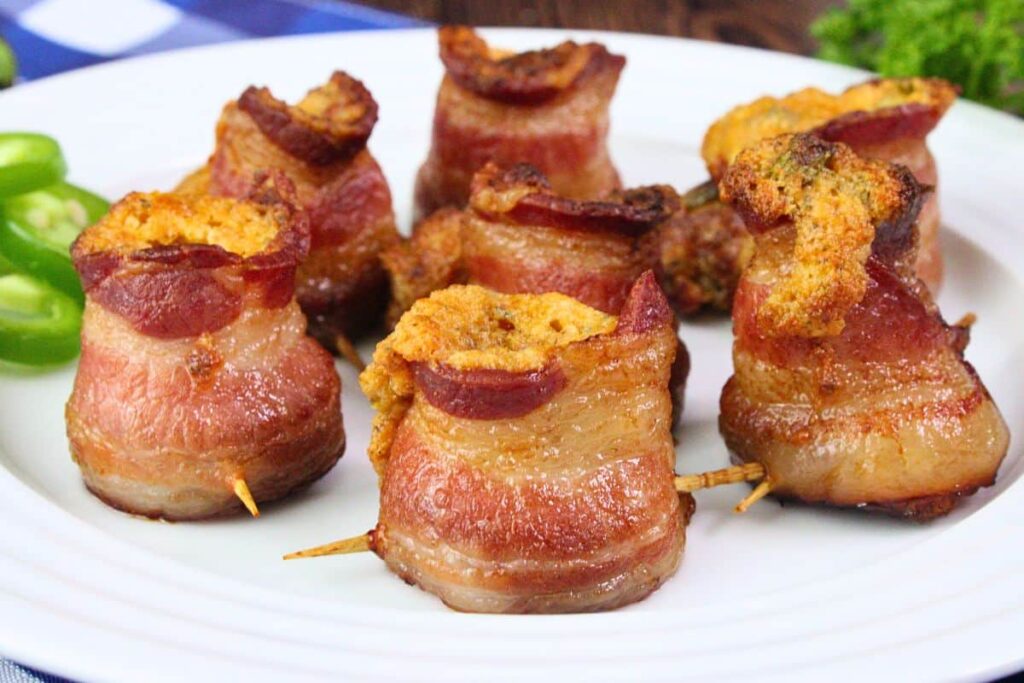closeup view of pig shots appetizers with toothpicks poking through the bacon