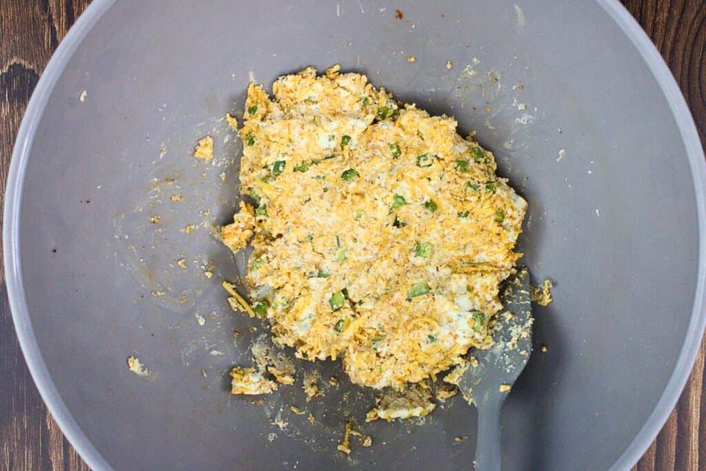 combine boursin, shredded cheese, jalapeno, and bbq rub in a small bowl