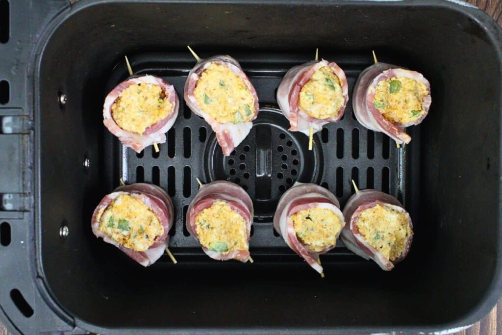 place filled pig shots in air fryer basket