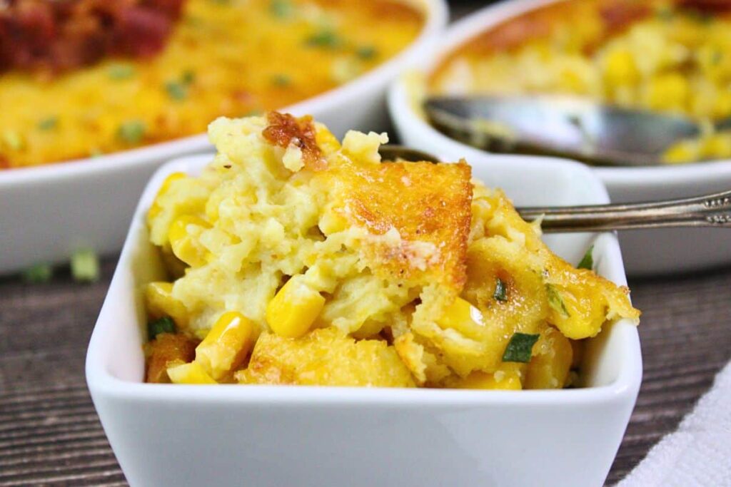 closeup view of air fryer corn pudding in a small square bowl