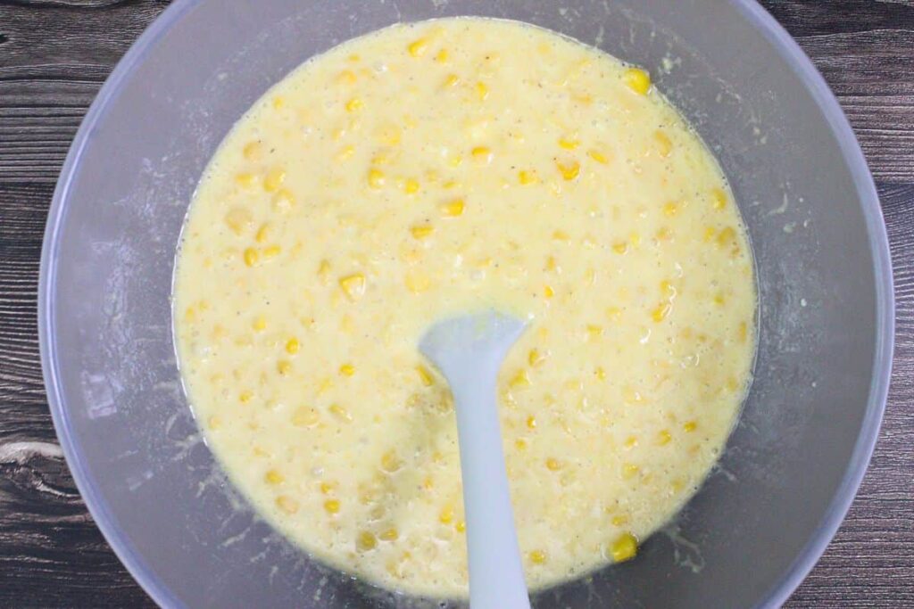 in a large bowl combine corn pudding ingredients except bacon and chives