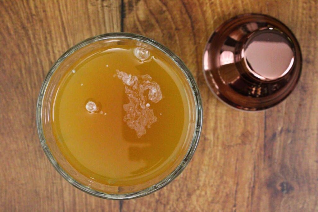 add apple pie cocktail ingredients to shaker