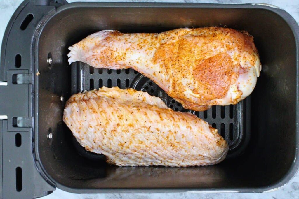 add seasoned turkey wings to air fryer basket