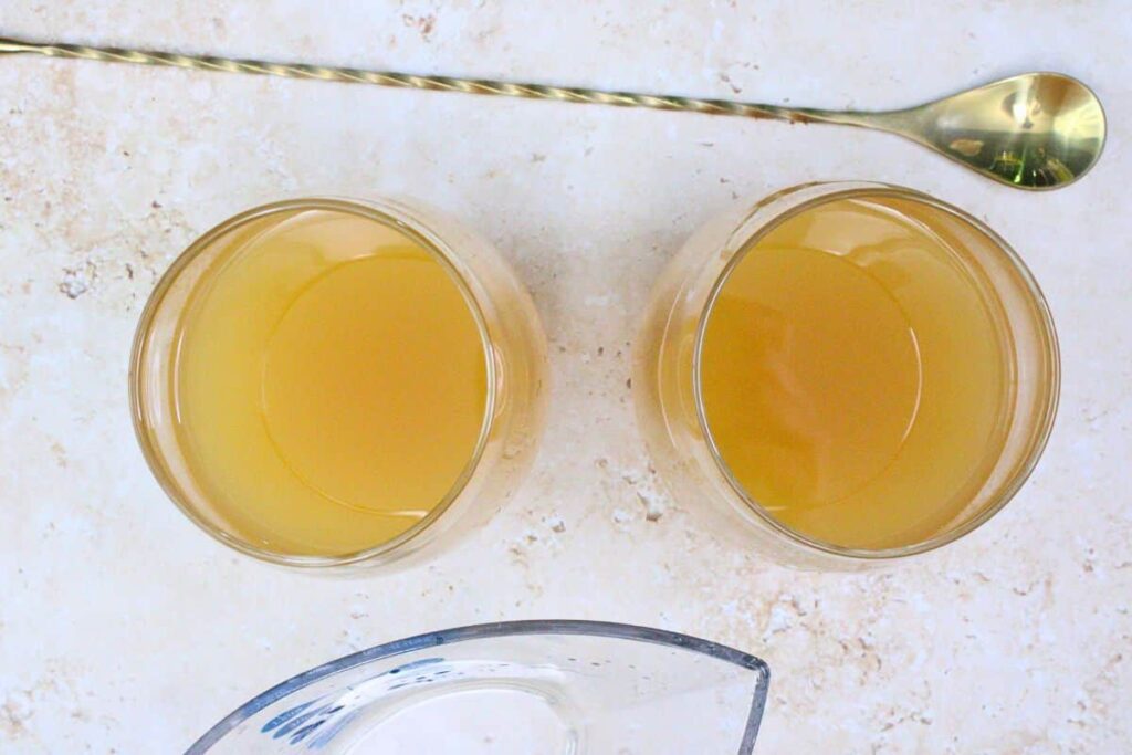 add white wine, brandy, and apple cider to wine glass