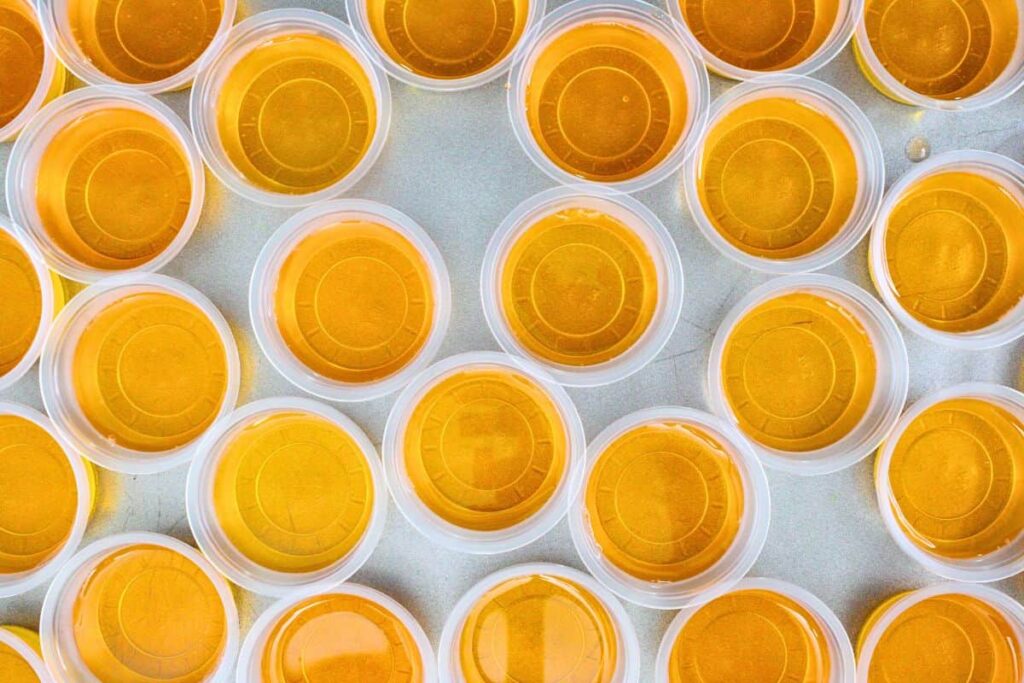 carefully pour orange jello layer on top of yellow one